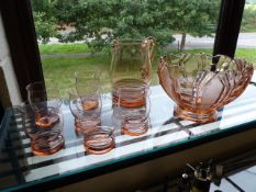 Pink glass cocktail bowl and jug along with six matching glasses