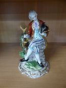 Porcelain figure of a Gentleman with cross sword marks to base