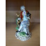Porcelain figure of a Gentleman with cross sword marks to base