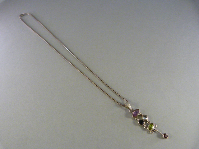 Silver articulated pendant set with various gemstones - Image 2 of 2