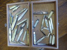 A selection of twenty eight fruit knives to include miniatures, mother of pearl, some with silver