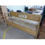 Antique pine settle with long lift up seat