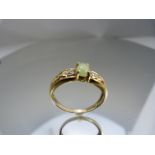 9ct Gold ring with central Jade stone and diamonds to each shoulder