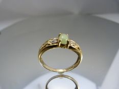 9ct Gold ring with central Jade stone and diamonds to each shoulder