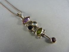 Silver articulated pendant set with various gemstones