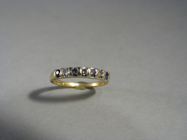Sapphire and Diamond half hoop eternity ring. Set with 4 small pale blue sapphires and 4 small 8 cut - Image 3 of 3