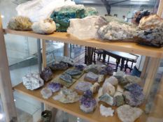 Large collection of semi precious stones over two shelves