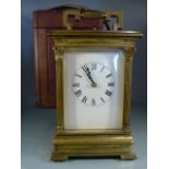 Brass cased carriage clock fitted with 5 bevelled glass panels. Inside lays a twin barrel striking