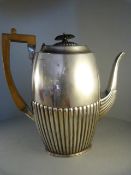 A silver coffee pot (hallmarks worn) with partly fluted decoration. Total weight Approx. 797g.