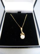 Boxed 14K yellow gold 6.7mm cultured pearl pendant and a 14K chain (20" long) Gross weight 2.7g