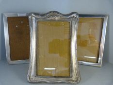 Three silver picture frames one by Green & Cadbury Ltd