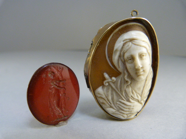 Carved shell Cameo of Religious Subject in repaired unmarked Gold Mount, measuring approx: 41.85mm x
