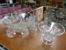 A Moulded Glass punch bowl with serving spoon and cups