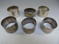 Five various hallmarked silver napkin rings and one other - Total Weight 147g