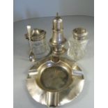 Silver ashtray, silver topped salt pot with silver spoon, silver pepper shaker and salt shaker.