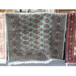 Green ground handwoven Bokhara 174cm x 123cm