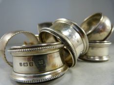 Three silver napkin rings by Charles Wilkes, two by William Hair Haseler and three further stamped