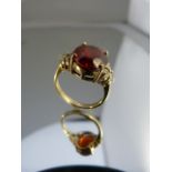 9ct Gold ring with Garnet set with 3 diamonds to each shoulder