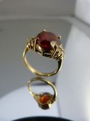 9ct Gold ring with Garnet set with 3 diamonds to each shoulder