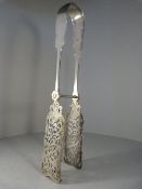 Pair of hallmarked silver tongs with pieced decoration to the spatulas - Sliding action pin in the
