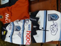 Three Cardiff Blues Rugby shirts with various signatures