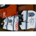 Three Cardiff Blues Rugby shirts with various signatures