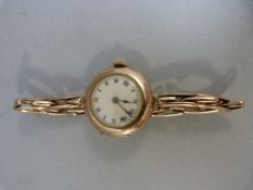 A Vintage Rolex Lady's 9ct Rose Gold cased wrist watch, white enamel dial with Roman Numerals with