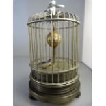 A 20th Century brass automata clock in the form of a bird cage with ticking bird