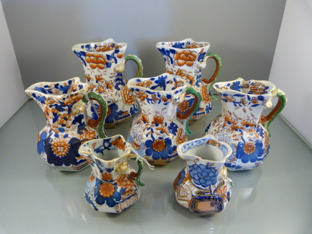 Seven 'Mason's Patent Ironstone china' graduated handpainted hydra jugs of octagonal form. Painted - Image 2 of 8