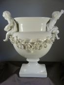 Vista Alegre, portuguese white porcelain vase on plinth, decorated with two cherubs holding