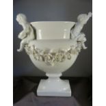 Vista Alegre, portuguese white porcelain vase on plinth, decorated with two cherubs holding