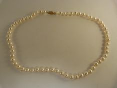 Cultured pearl necklace 18.5" long with approx 7mm pearls with 14ct clasp