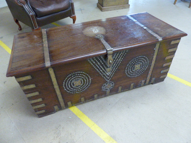 Zanzibar African hardwood brass mounted chest with studded decoration to front, rising lid and - Image 2 of 2