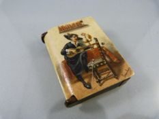 Novelty early Bakelite Vesta case with handpainted picture of a Spaniard playing the guitar and