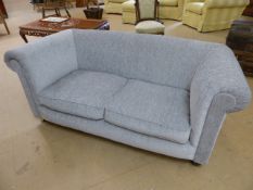 Two seater newly upholstered sofa on wooden bun feet