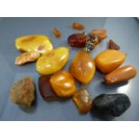 Collection of Raw butterscotch amber and various butterscotch pendants