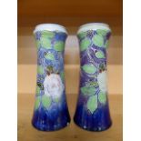 Pair of Royal Doulton vases in the Moorcroft style depicting roses 7816C - 1 with small chip to