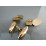 Pair of 9ct Gold cufflinks hallmarked Birmingham 1950 with engine turned design and one other Rose