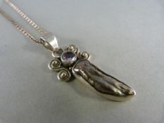 Silver pendant set with baroque pearl and pale amethyst