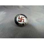 German badge marked 'HEIM INS REICH' with swastika