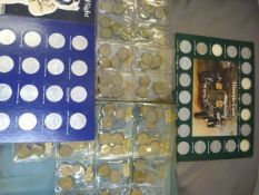 Collection of collector coins in cases