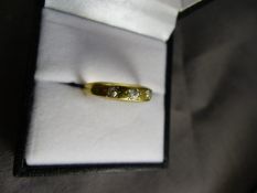 Three stone diamond ring set in 18ct Gold. Weight 2.4g, size M