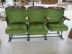 Set of three oak theatre chairs with Royal Green Upholstery and cast iron metal frames. Wooden