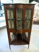 Unusual glass fronted Edwardian inlaid corner cabinet with three glass panels (one curved) inside