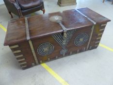 Zanzibar African hardwood brass mounted chest with studded decoration to front, rising lid and