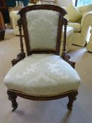 Nursing chair with mahogany frame and pillared decoration to sides