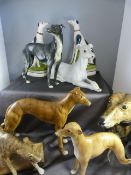 Six figures of greyhounds all unmarked along with a pair of black and white Staffordshire greyhounds