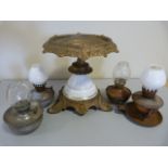 Metal and china table centre with four miniature nursery oil lamps complete with glass shades