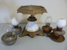 Metal and china table centre with four miniature nursery oil lamps complete with glass shades