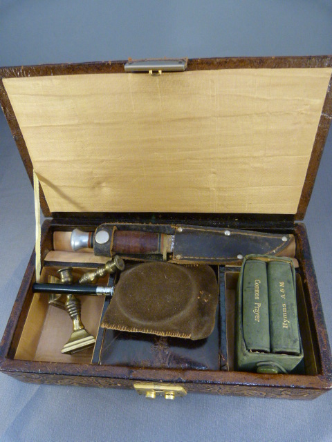 Leather jewellery box containing miniature candlesticks, miniature glass, miniature prayer books
